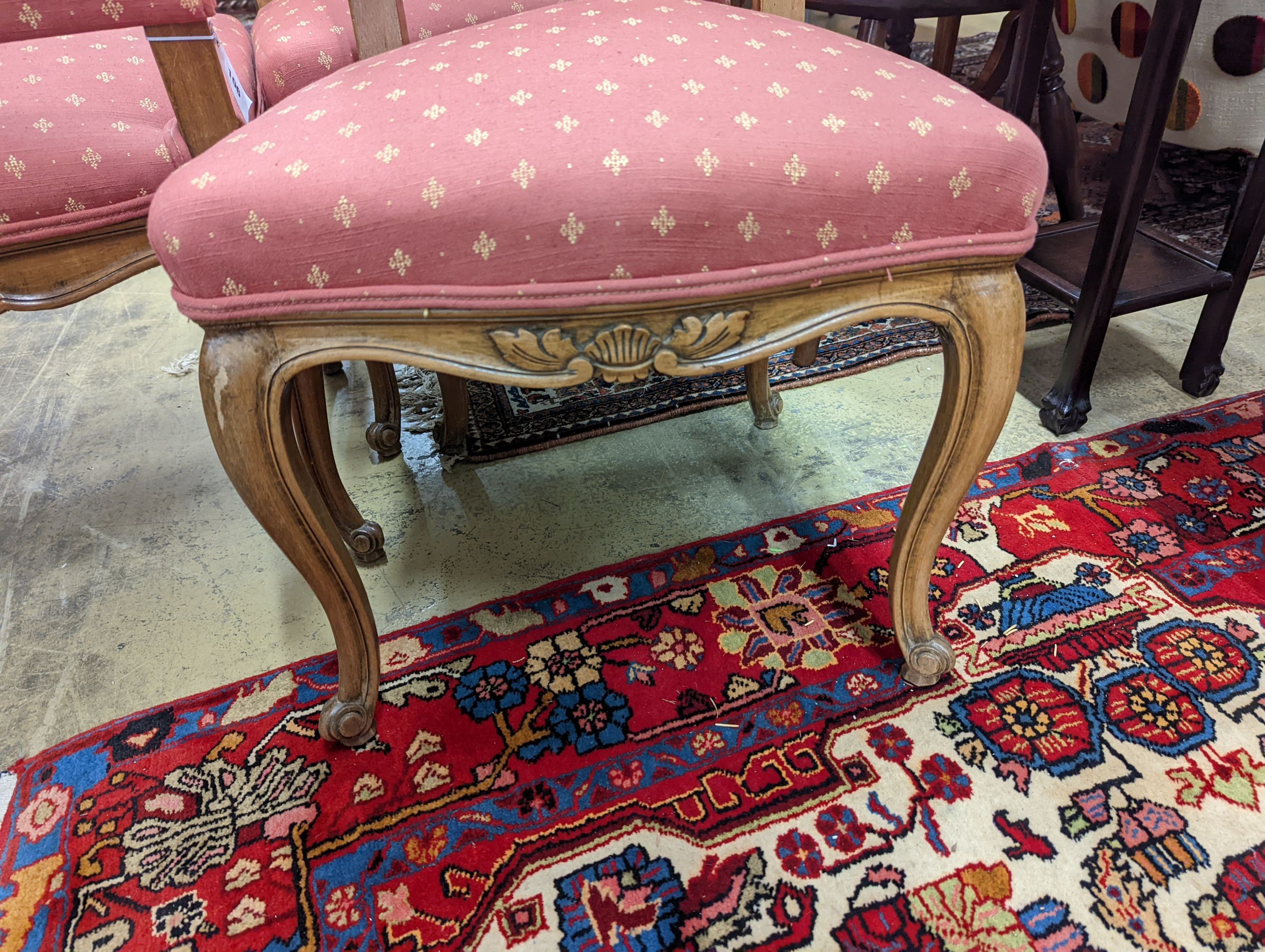 A set of eight French walnut dining chairs